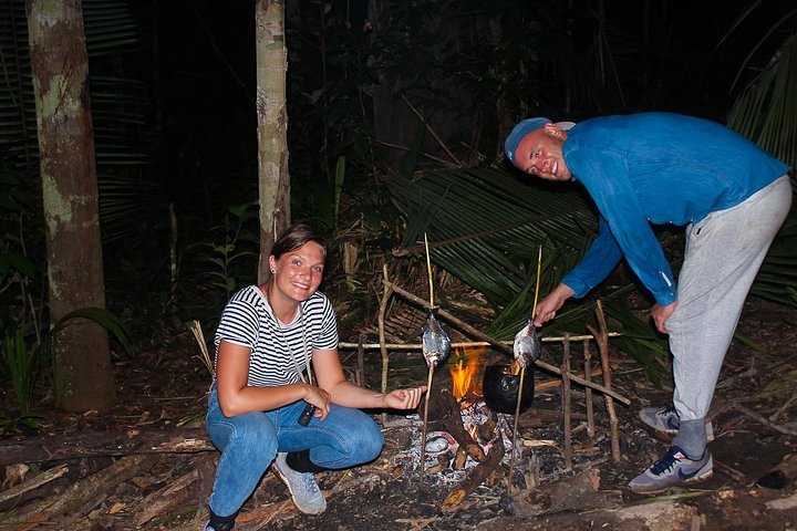 preparing dinner out in the jungle