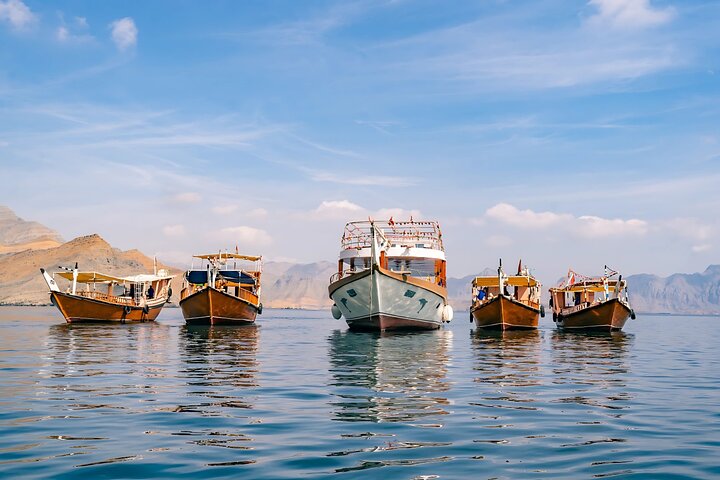 Discover the stunning Musandam fjords—the perfect backdrop for your dhow cruise.