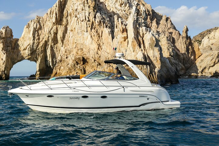Sail past the iconic Arch of Cabo on your private yacht charter for an exclusive snorkeling and beach adventure.