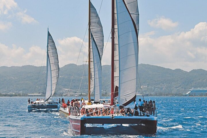 Get ready to sail and party! Enjoy Montego Bay snorkeling with an open bar and a live Reggae DJ on a catamaran!