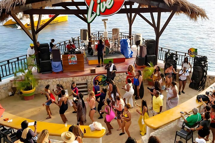 End your day the Jamaican way by sailing into the sunset, enjoying unlimited drinks, and dancing to a live DJ at Negril's hottest cliffside party spot!