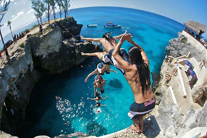 Feel the adrenaline rush as you take the plunge from the famous Negril cliffs, a thrilling stop on your morning catamaran sail to snorkel the turquoise waters!