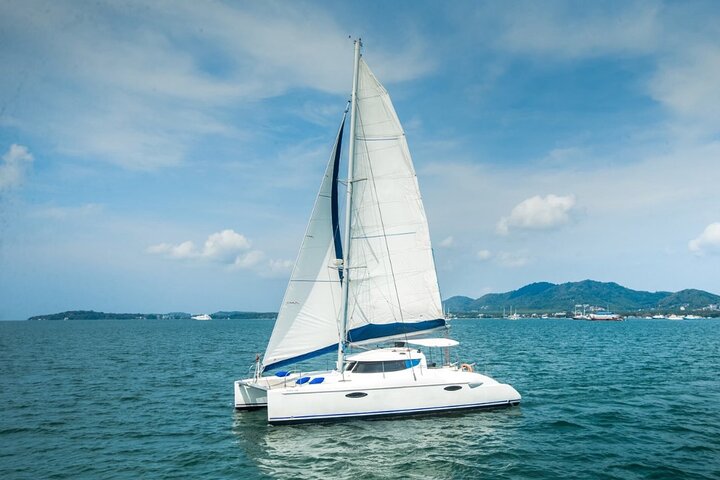 Phuket Catamaran Tour in Coral Island and Sunset Voyage